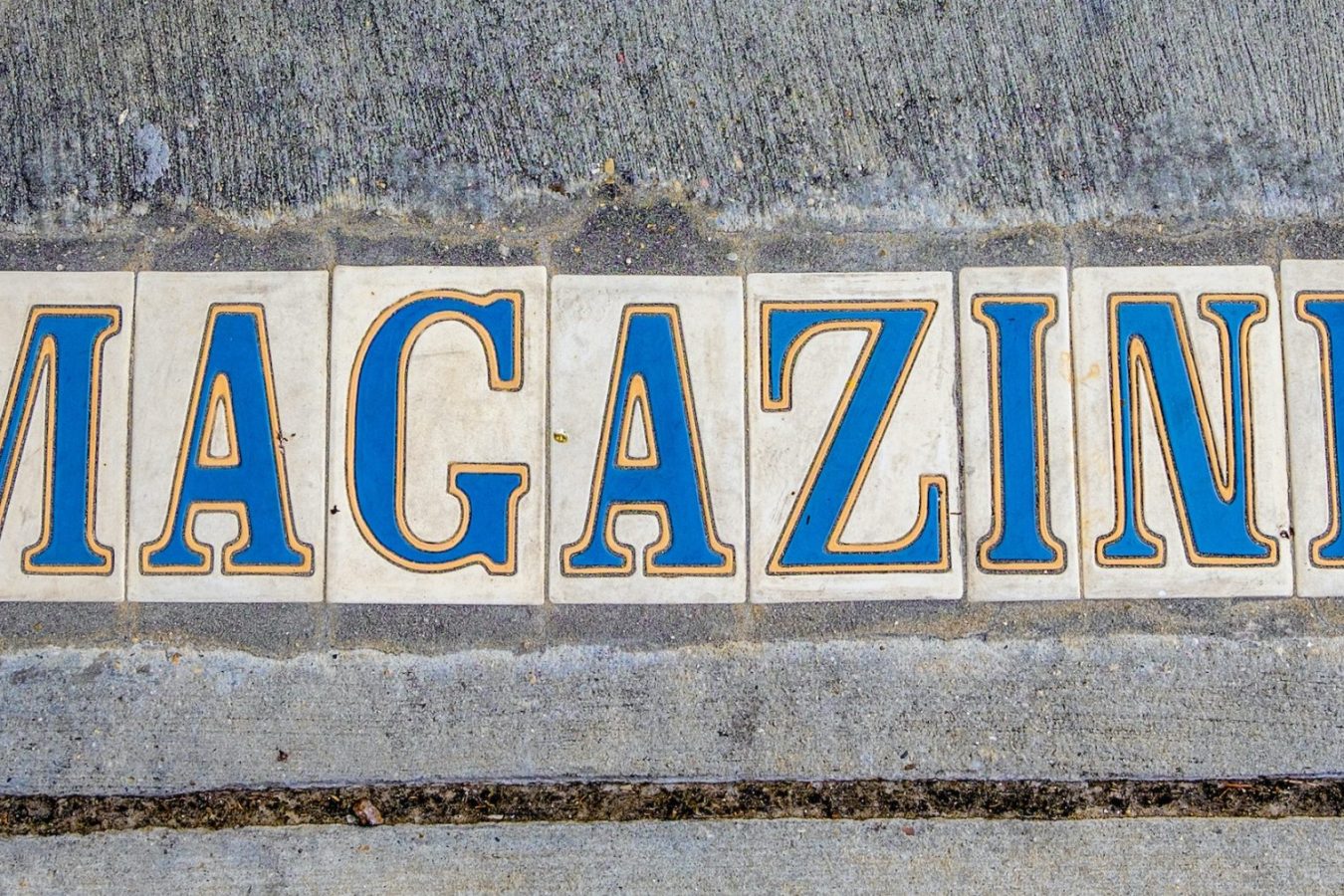 Sidewalk sign for Magazine Street in New Orleans, Louisiana